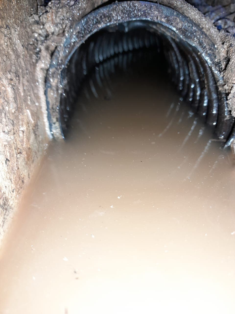 Standing water in a drainage pipe — a late-stage waterproofing problem