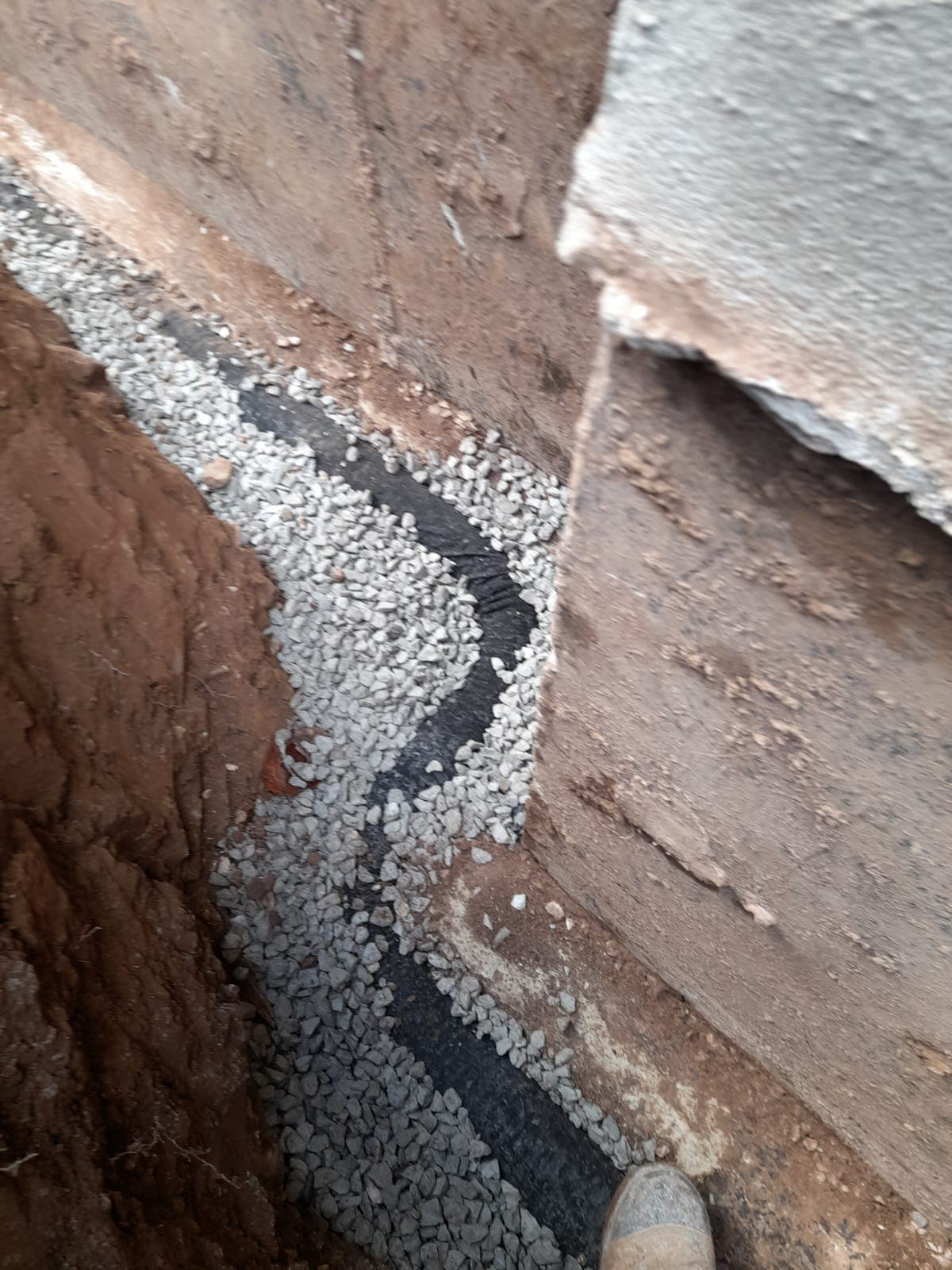 Waterproof Barrie crew work in a foundation trench