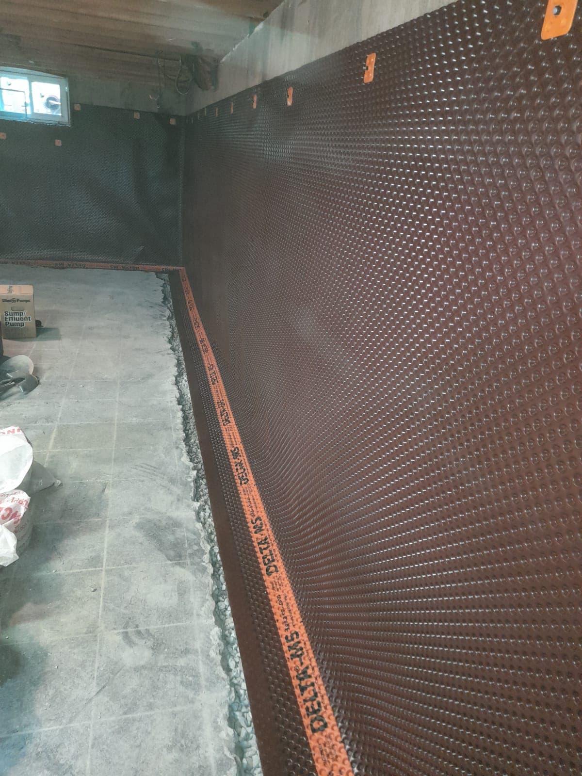 Interior dimpled membrane during waterproofing
